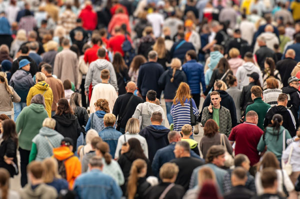 A crowd of people walking