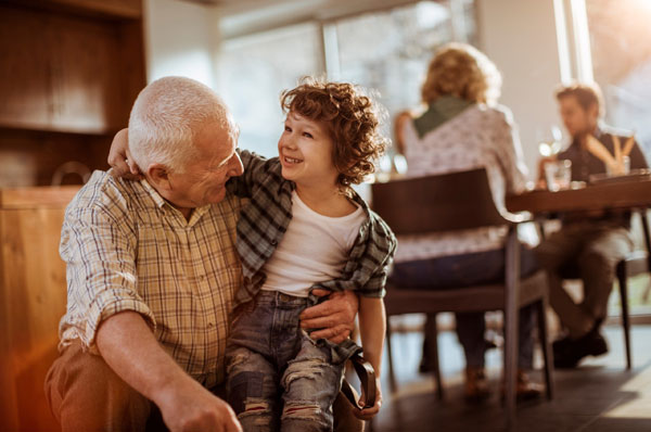 Grandfather hugging his grandchild